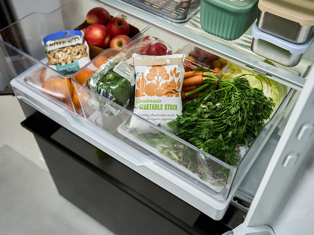 A fridge crisper drawer with a bag of nuts sealed with a Blueberry Looplock